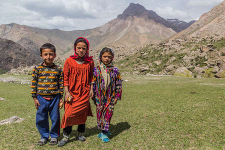 HAFT KUL, TAJIKISTAN - MAY 11, 2018: Young children on a pasture in Marguzor (Haft Kul) in Fann mountains, Tajikistanのeditorial素材