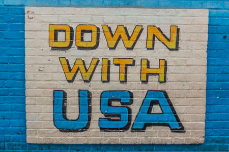 TEHRAN, IRAN - APRIL 15, 2018: Propaganda painting at the former US Embassy (now U.S. Den of...