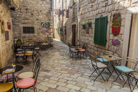 KOTOR, MONTENEGRO - JUNE 1, 2019: Open air restaurant in a narrow alley in the Old Town of Kotor, Montenegro.のeditorial素材
