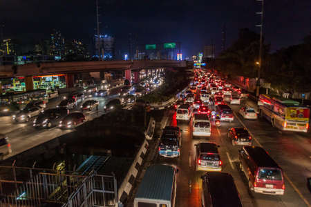 MANILA, PHILIPPINES - JANUARY 29, 2018: Night highway traffic in Manila, Philippines