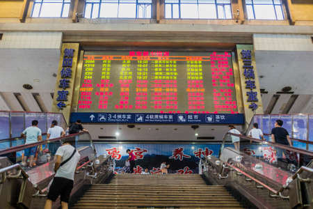 XI'AN, CHINA - AUGUST 6, 2018: Departure board at the Xi'an railway station, Chinaのeditorial素材