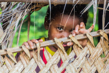TAMAN NEGARA, MALAYSIA - MARCH 17, 2018: Indigenous baby in a village in Taman Negara national park, Malaysiaのeditorial素材