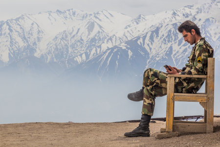 ALAMUT, IRAN - APRIL 4, 2018: Soldier guarding the ruins of Alamut (meaning eagle's nest) castle in...