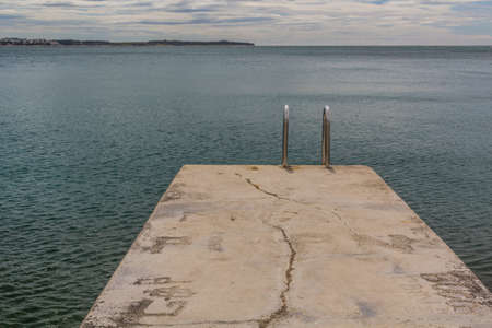Pier with a ladder in Piran, Sloveniaの写真素材