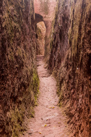 Narrow passage connecting rock-hewn churches in Lalibela, Ethiopiaの写真素材