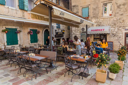 KOTOR, MONTENEGRO - JUNE 1, 2019: Open air restaurant in the Old Town of Kotor, Montenegro.のeditorial素材
