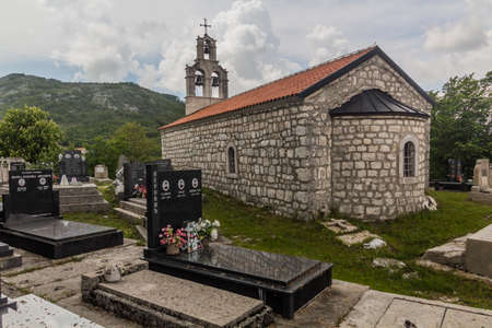 BJELOSI, MONTENEGRO - JUNE 2, 2019: Church and cemetery in Bjelosi village, Montenegroのeditorial素材