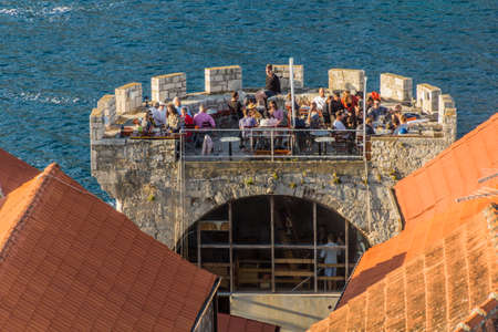 KORCULA, CROATIA - MAY 29, 2019: Massimo bar at a  tower in Korcula town, Croatiaのeditorial素材