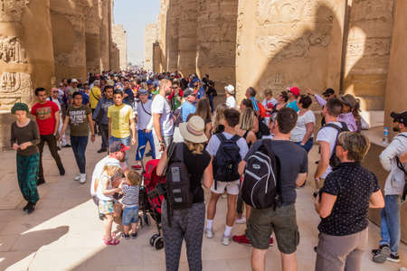LUXOR, EGYPT - FEB 21, 2019: Crowds of tourists in the Great Hypostyle Hall in the Amun Temple enclosure in Karnak, Egyptのeditorial素材