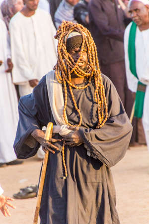 OMDURMAN, SUDAN - MARCH 8, 2019: Sufi Whirling Dervish during the traditional Friday religious ceremony at Hamed al Nil cemetery in Omdurman, Sudanのeditorial素材