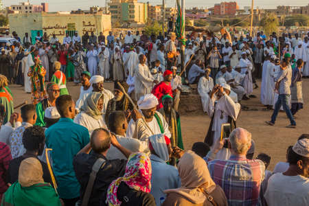 OMDURMAN, SUDAN - MARCH 8, 2019: People watch Sufi Whirling Dervishes during a religious ceremony at Hamed al Nil cemetery in Omdurman, Sudanのeditorial素材