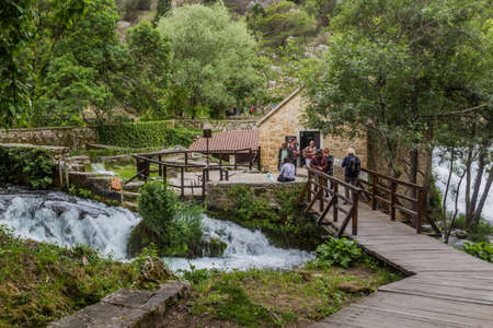 KRKA, CROATIA - MAY 26, 2019: Tourists visit a mill in Krka national park, Croatiaのeditorial素材