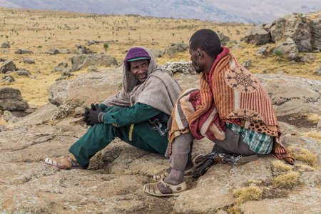 SIMIEN MOUNTAINS, ETHIOPIA - MARCH 16, 2019: Armed scouts guarding tourists in Simien mountains, Ethiopiaのeditorial素材