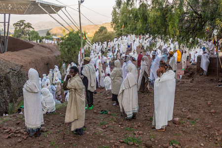 LALIBELA, ETHIOPIA - MARCH 31, 2019: Group of devotees during the Sunday service at Bet Medhane...