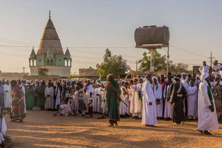 OMDURMAN, SUDAN - MARCH 8, 2019: People watch Sufi Whirling Dervishes during a religious ceremony at Hamed al Nil cemetery in Omdurman, Sudanのeditorial素材