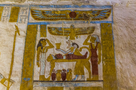BAWITI, EGYPT - FEBRUARY 5, 2019: Wall painitngs of the embalming process in the Tomb of Bannentiu...