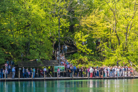 PLITVICE, CROATIA - MAY 24, 2019: Tourists at P2 pier in Plitvice Lakes National Park, Croatiaのeditorial素材
