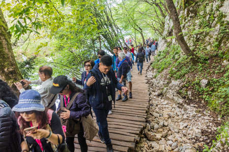 PLITVICE, CROATIA - MAY 24, 2019: Tourists visit Plitvice Lakes National Park, Croatia