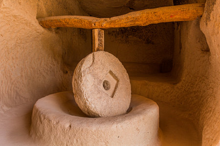 Old stone mill in a rock dwelling in Zelve, Cappadocia, Turkey