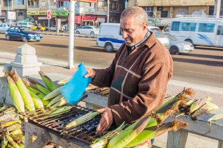 ALEXANDRIA, EGYPT - FEBRUARY 1, 2019: Street food roasted corn stall in Alexandria, Egyptのeditorial素材