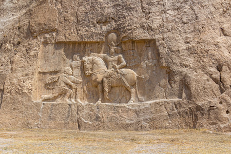 Triumph of Shapur I over the Roman emperors Valerian and Philip the Arab bas-relief in Naqsh-e Rostam, Iranの写真素材