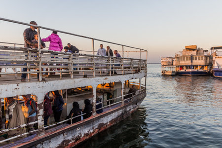 LUXOR, EGYPT - FEB 18, 2019: Passengers of a ferry across the river Nile in Luxor, Egyptのeditorial素材