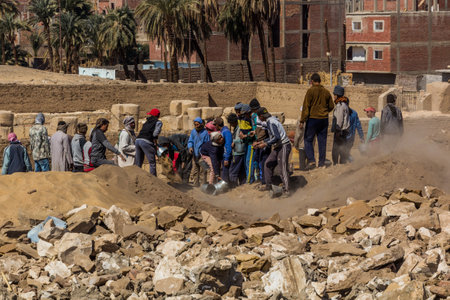 ABYDOS, EGYPT - FEB 19, 2019: Group of workers at excavations in Abydos, Egyptのeditorial素材