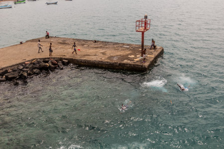 TADJOURA, DJIBOUTI - APRIL 20, 2019: Locals on a pier in the port of Tadjoura, Djiboutiのeditorial素材