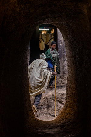 LALIBELA, ETHIOPIA - MARCH 29, 2019: People in a maze of rock-cut churches in Lalibela, Ethiopiaのeditorial素材