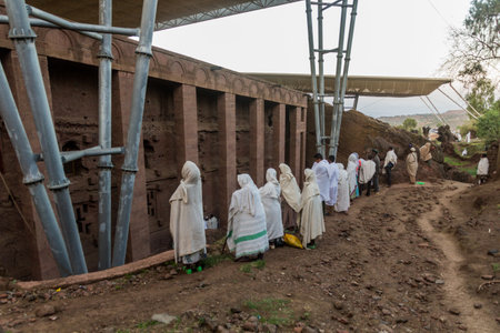 LALIBELA, ETHIOPIA - MARCH 31, 2019: Group of devotees during a Sunday service at Bet Medhane Alem, rock-cut church in Lalibela, Ethiopiaのeditorial素材