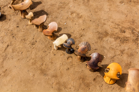 Daasanach tribe-made wooden seats for sale in their village near Omorate, Ethiopiaの写真素材