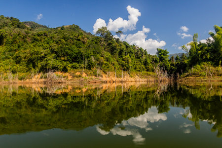 Reflections in waters of Nam Ou 5 reservoir, Laos