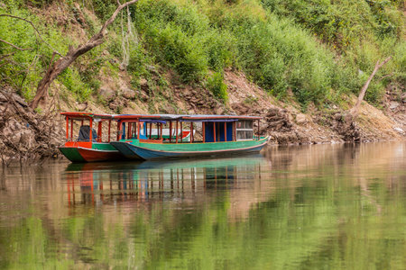 Boats at Nam Ou river in Phongsali province, Laosの写真素材