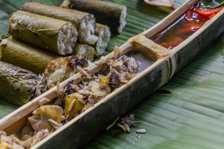 Meal served in bamboo in the forest of Nam Ha National Protected Area, Laosの写真素材