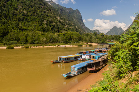 Boats at Nam Ou river in Muang Ngoi Neua village, Laosの写真素材