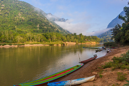 Boats at Nam Ou river in Muang Ngoi Neua village, Laosの写真素材