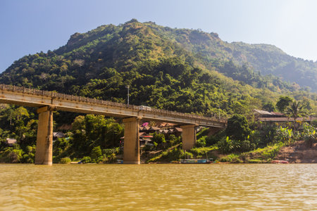 Bridge across Nam Ou river in Nong Khiaw, Laosの写真素材