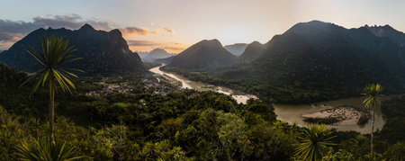 Sunset panorama of Muang Ngoi Neua village and Nam Ou river from Phanoi viewpoint, Laosの写真素材