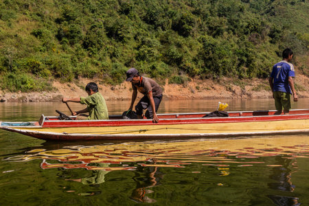 NAM OU, LAOS - NOVEMBER 23, 2019: Boat at Nam Ou river in Phongsali province, Laosのeditorial素材