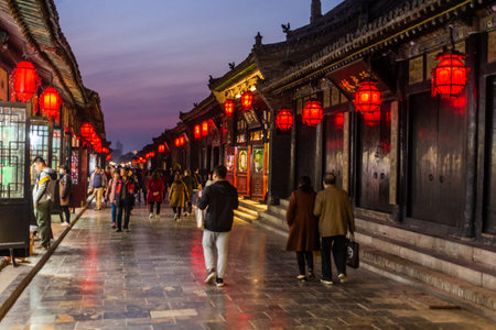 PINGYAO, CHINA - OCTOBER 21, 2019: Evening view of a cobbled street in Pingayo Ancient City, Chinaのeditorial素材