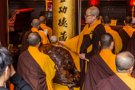 SHANGHAI, CHINA - OCTOBER 24, 2019: Buddhist monks praying in Jade Buddha Temple in Shanghai, Chinaのeditorial素材