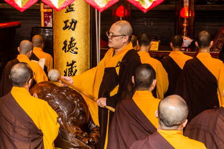SHANGHAI, CHINA - OCTOBER 24, 2019: Buddhist monks praying in Jade Buddha Temple in Shanghai, China
