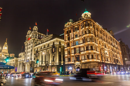 SHANGHAI, CHINA - OCTOBER 25, 2019: Night view of the historical buildings at The Bund in Shanghai,...