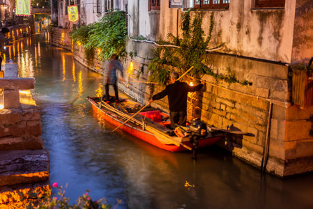 LUZHI, CHINA - OCTOBER 27, 2019: Evening view of a boat in Luzhi water town, Jiangsu province, Chinaのeditorial素材