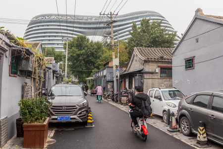 BEIJING, CHINA - OCTOBER 17, 2019: View of Galaxy SOHO complex building from nearby hutong traditional neighborhood in Beijing, Chinaのeditorial素材