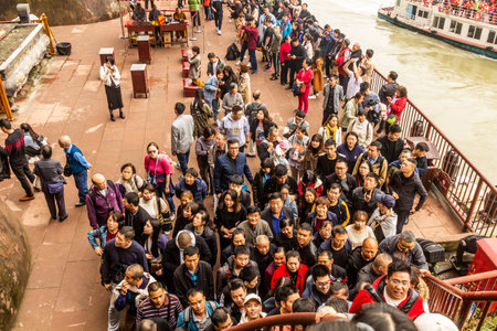 LE SHAN, CHINA  - NOVEMBER 6, 2019: Crowds of tourists at the feet of the Giant Buddha in Leshan, Sichuan province, Chinaのeditorial素材
