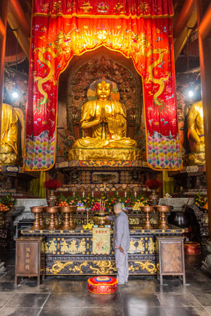 LE SHAN, CHINA  - NOVEMBER 6, 2019: Buddha statue in a Buddhist temple in the compound of Giant Buddha in Le Shan, Sichuan province, Chinaのeditorial素材