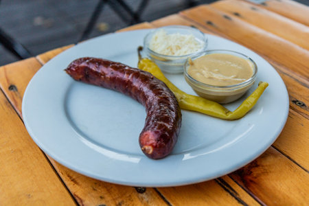 Typical Czech snack - sausage with mustard and horseradish