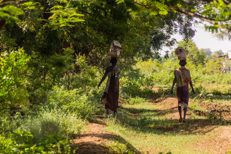 OMORATE, ETHIOPIA - FEBRUARY 5, 2020: Daasanach tribal women near Omo river, Ethiopiaのeditorial素材