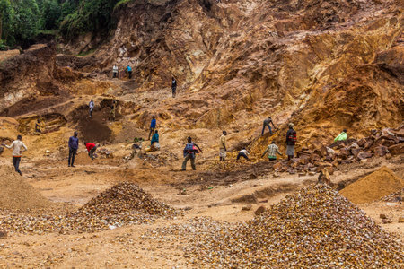 KABALE, UGANDA - MARCH 18, 2020: Local people excavating stone in a quarry near Kabale, Uganda